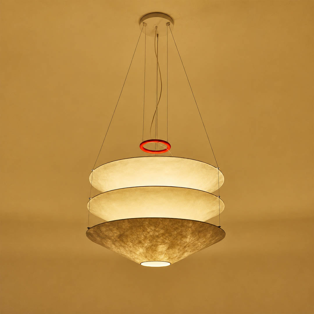 Kōun pendant light illuminated warm bulb evening glow ambient atmospheric soft light layered shades three tiers detail close up modern Art Deco