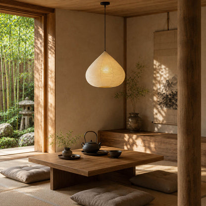 Kuri pendant light 17.7 inch reading corner armchair cozy intimate Japandi warm ambient sculptural chestnut Japanese lifestyle interior