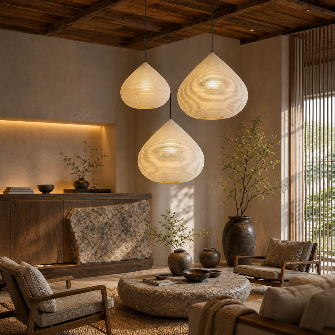 Kuri pendant light 17.7 inch reading corner armchair cozy intimate Japandi warm ambient sculptural chestnut Japanese lifestyle interior