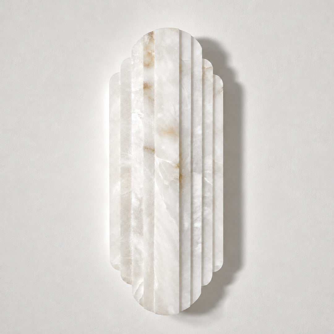 Lamina alabaster wall sconce shown lit and unlit side by side