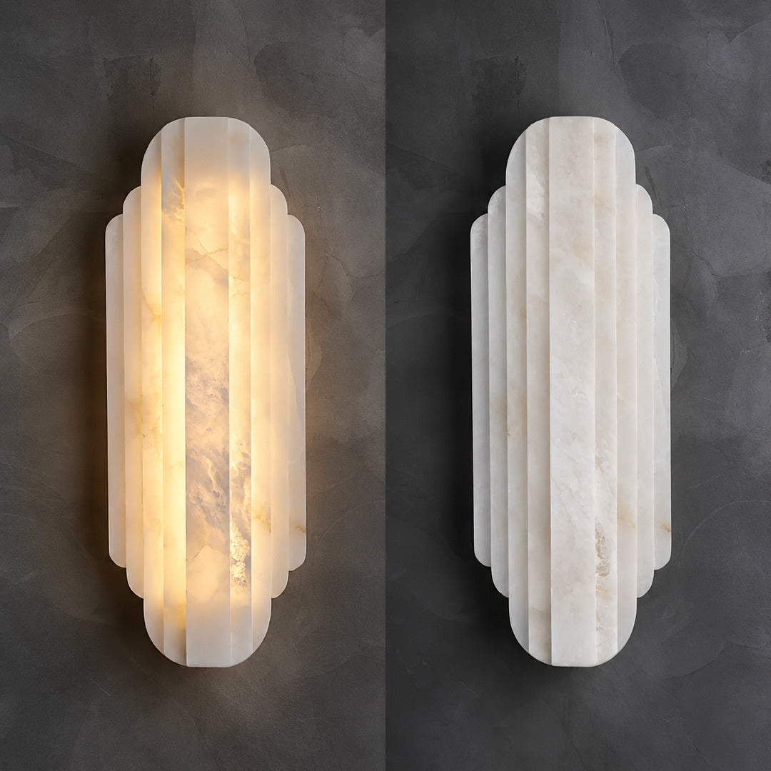 Lamina alabaster wall sconce shown lit and unlit side by side