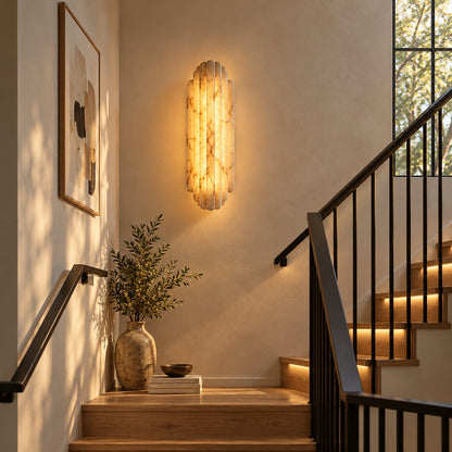 Lamina alabaster wall sconces along a staircase wall