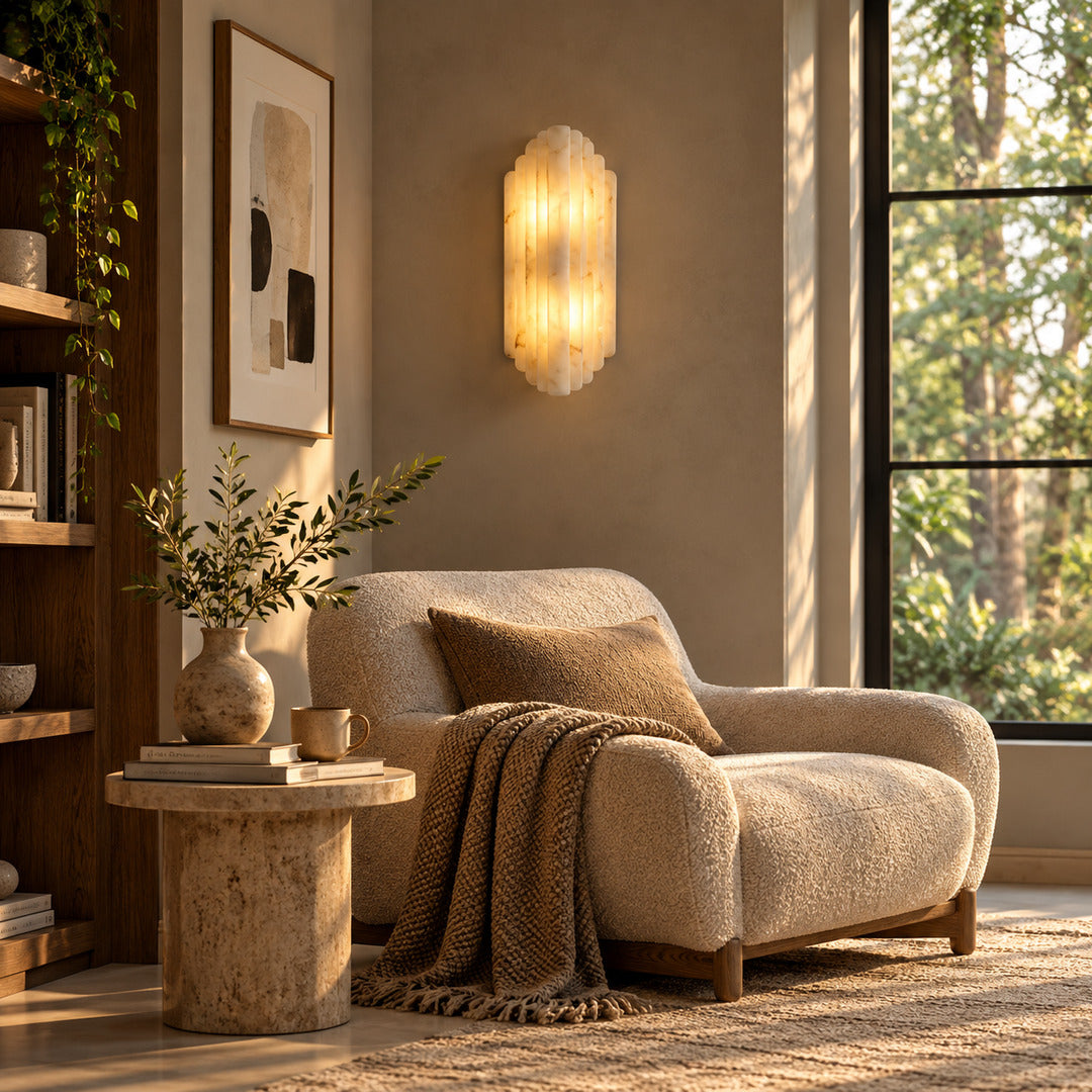 Pair of Lamina alabaster wall sconces above a sofa in a modern living room