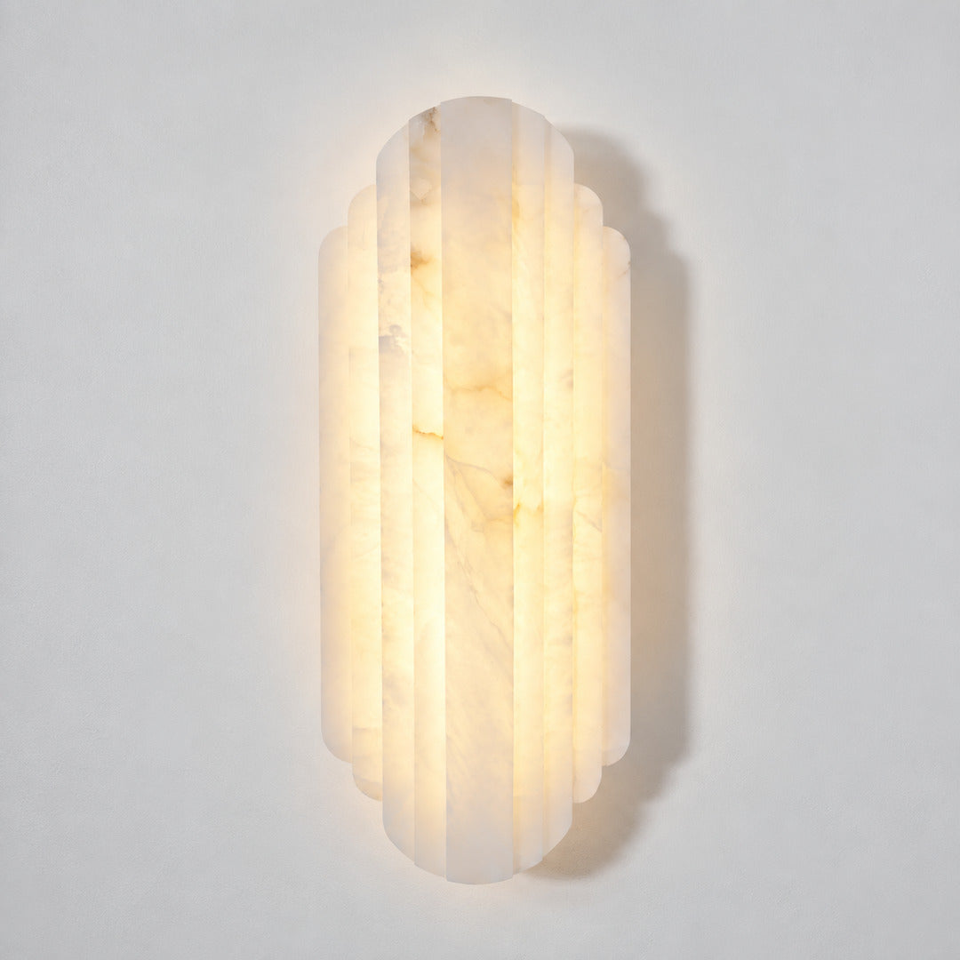 Lamina alabaster wall sconce shown lit and unlit side by side