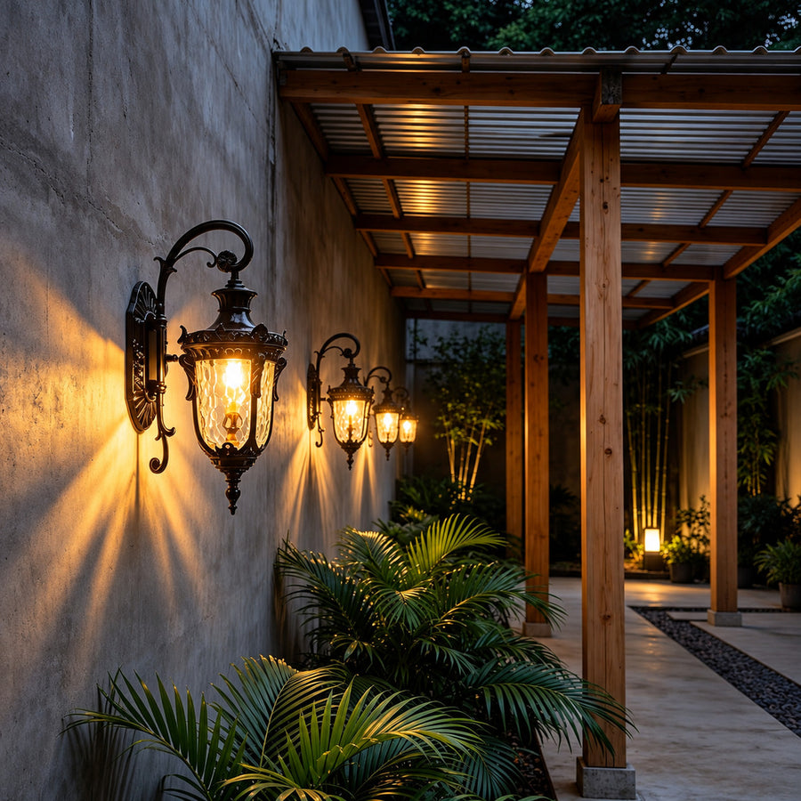 Lanterna outdoor wall sconce lighting a garden wall with a soft warm glow at dusk
