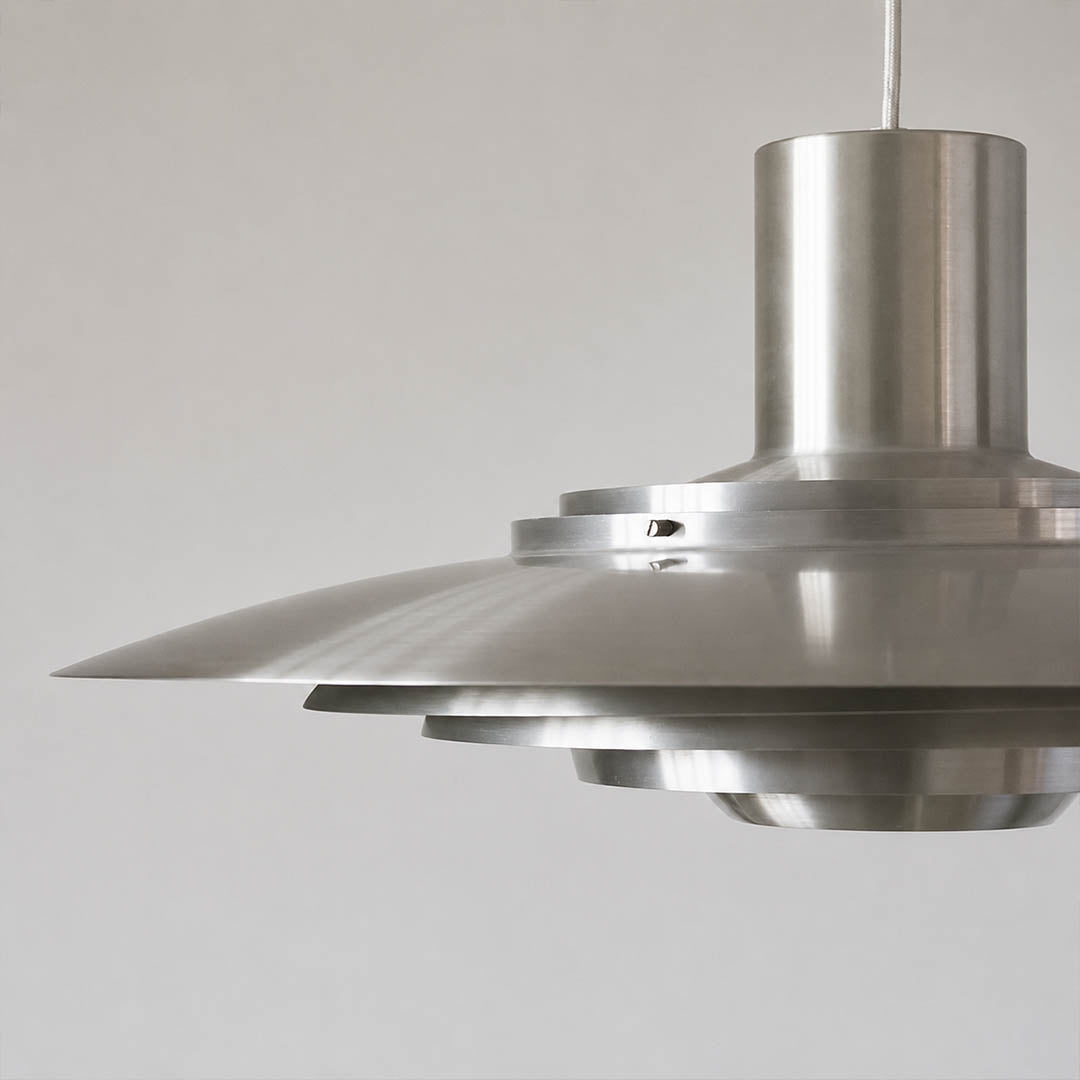 Larkin P376 disc side profile flat aluminum minimalist Mid Century geometric craftsmanship detail close up