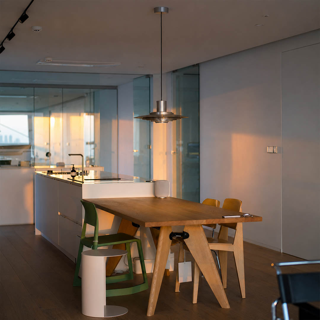 Larkin White P376 style aluminum disc pendant dining room Modern Scandinavian minimalist designer warm glow interior lifestyle