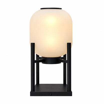 Larsen outdoor solar lantern floor lamp with a warm glowing shade on a black frame.