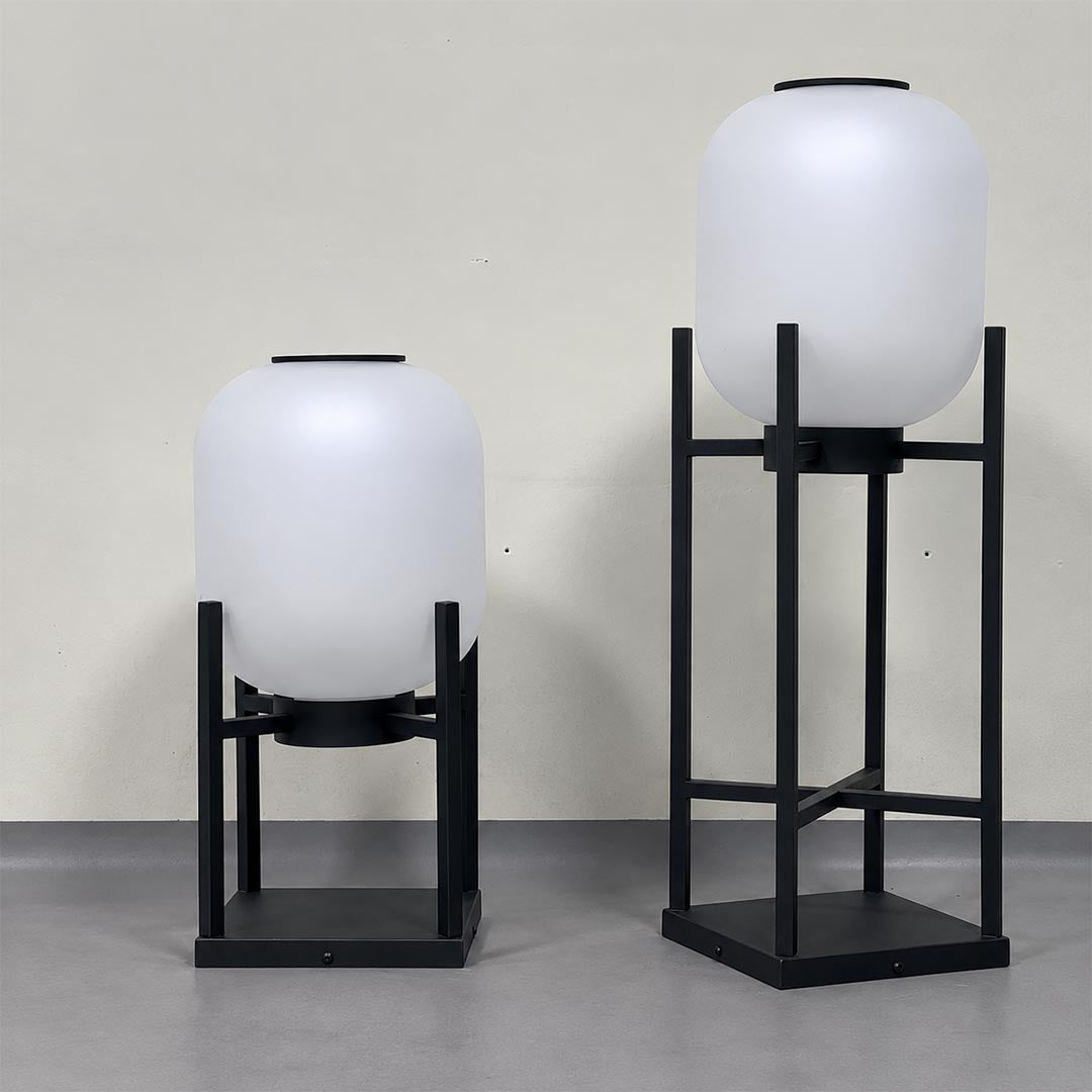 Pair of Larsen solar outdoor floor lamps showing short and tall black frame sizes.