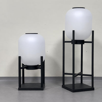 Pair of Larsen solar outdoor floor lamps showing short and tall black frame sizes.