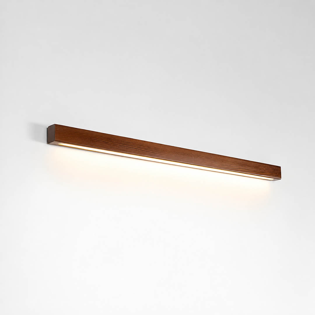 Larsson linear wood wall light walnut color wood integrated LED warm glow slim linear bar white background front view