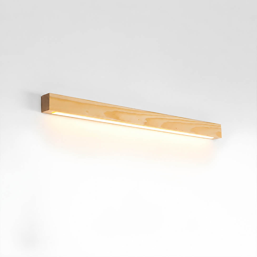 Larsson linear wood wall light natural pine wood color integrated LED warm glow slim bar white background front view