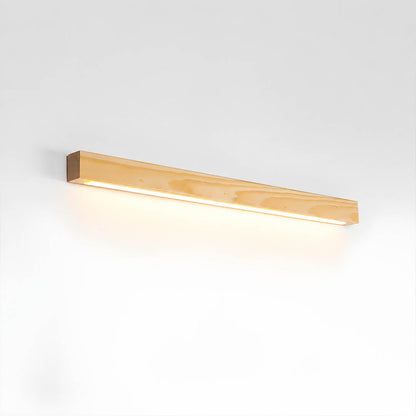 Larsson linear wood wall light natural pine wood color integrated LED warm glow slim bar white background front view