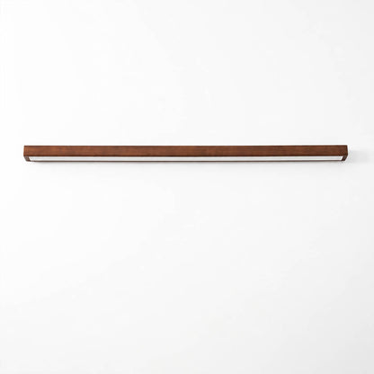 Larsson linear wood wall light walnut color wood integrated LED warm glow slim linear bar white background front view