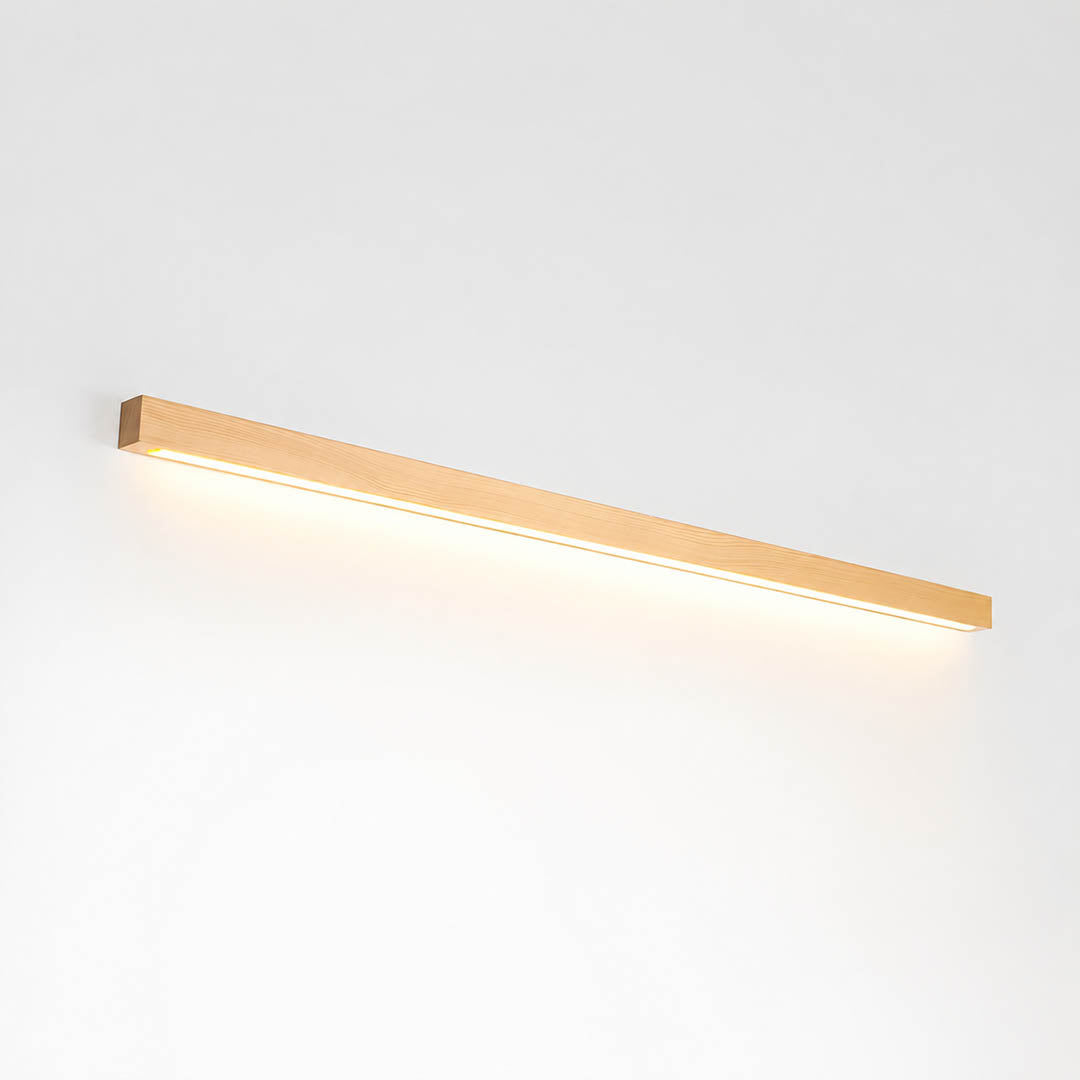 Larsson linear wood wall light natural pine wood color integrated LED warm glow slim bar white background front view