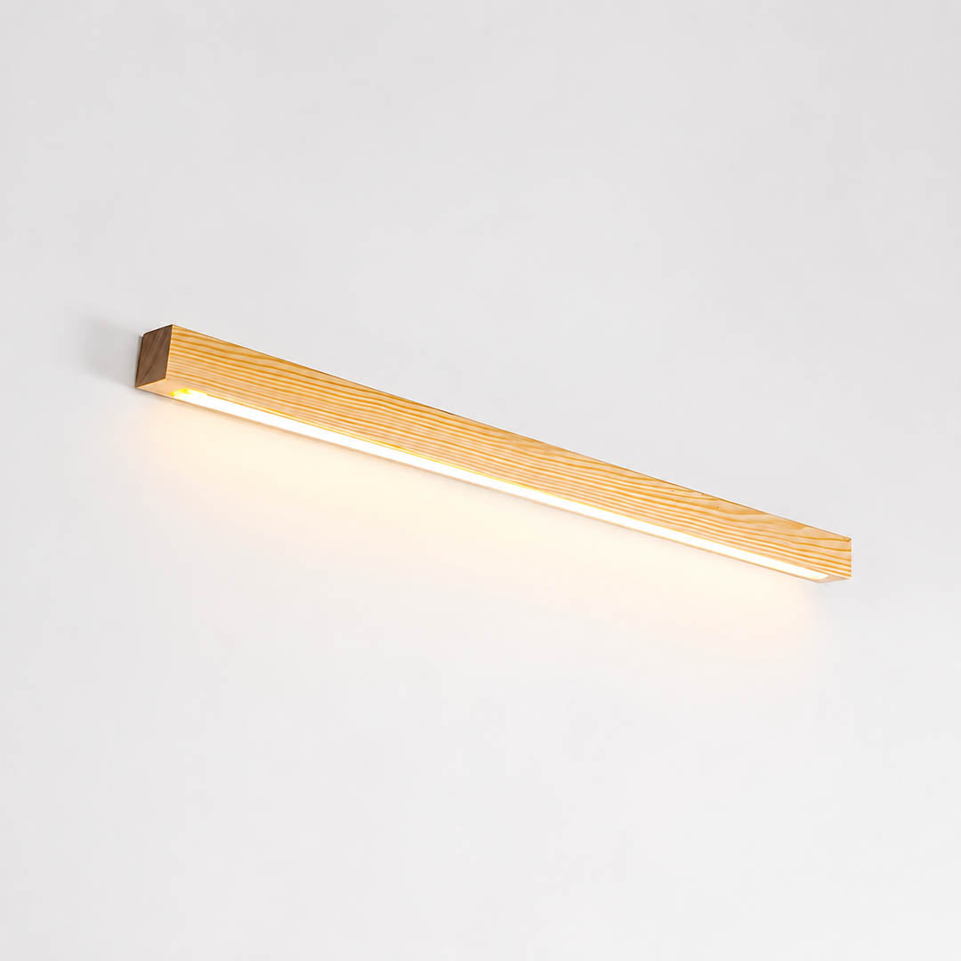 Larsson linear wood wall light natural pine wood color integrated LED warm glow slim bar white background front view