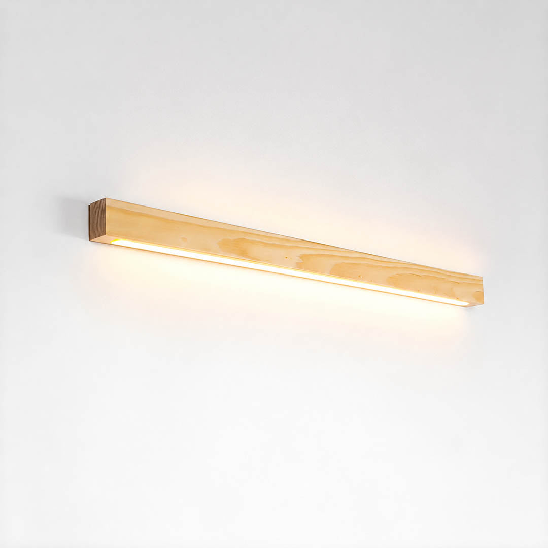 Larsson linear wood wall light natural pine wood color integrated LED warm glow slim bar white background front view