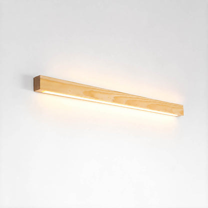 Larsson linear wood wall light natural pine wood color integrated LED warm glow slim bar white background front view