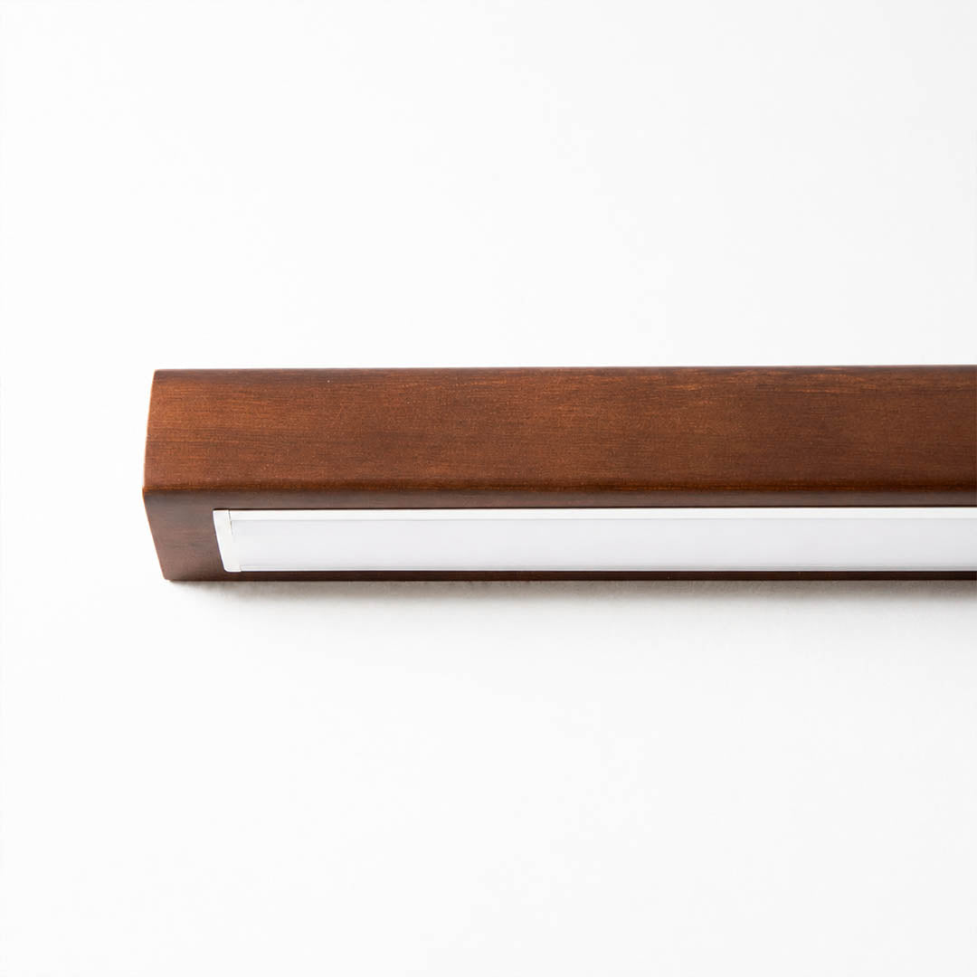 Larsson linear wood wall light natural pine wood grain texture detail close up organic warm craftsmanship
