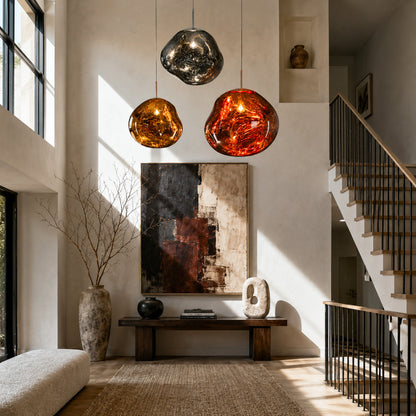 Lava pendant light welcoming guests with a molten mirror-effect silhouette in an entryway