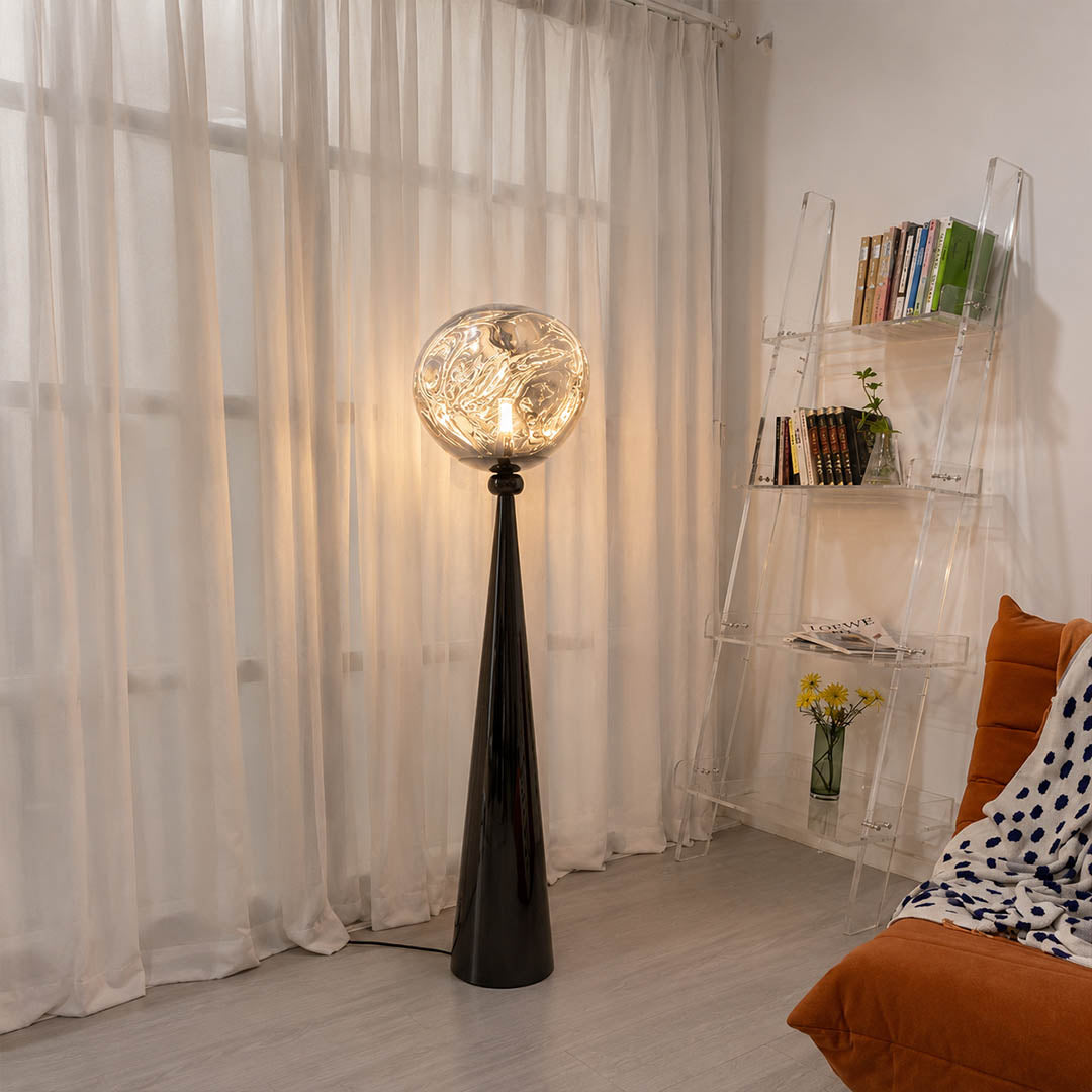 Lava sculptural floor lamp modern living room beside sofa gold metallic molten statement ambient American home lifestyle interior
