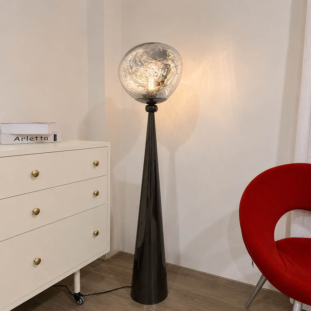 Lava sculptural floor lamp living room beside leather recliner reading corner chrome molten statement American home lifestyle interior