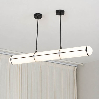 Linea pendant light brass metal slim band frame refined detail architectural fasteners polished finish close up sophisticated modern