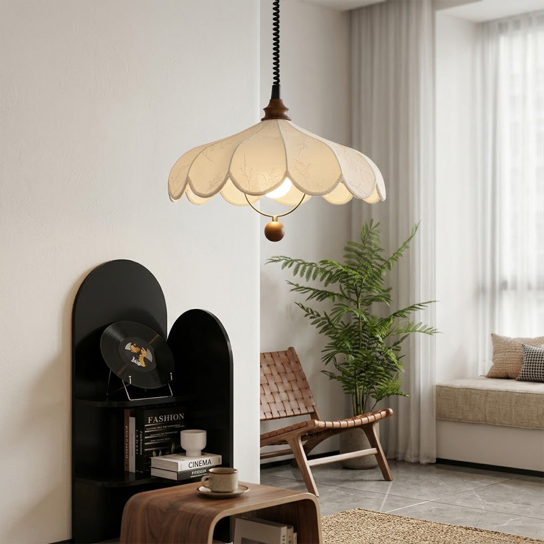 Linen drum pendant light above bedroom or living room warm ambient glow