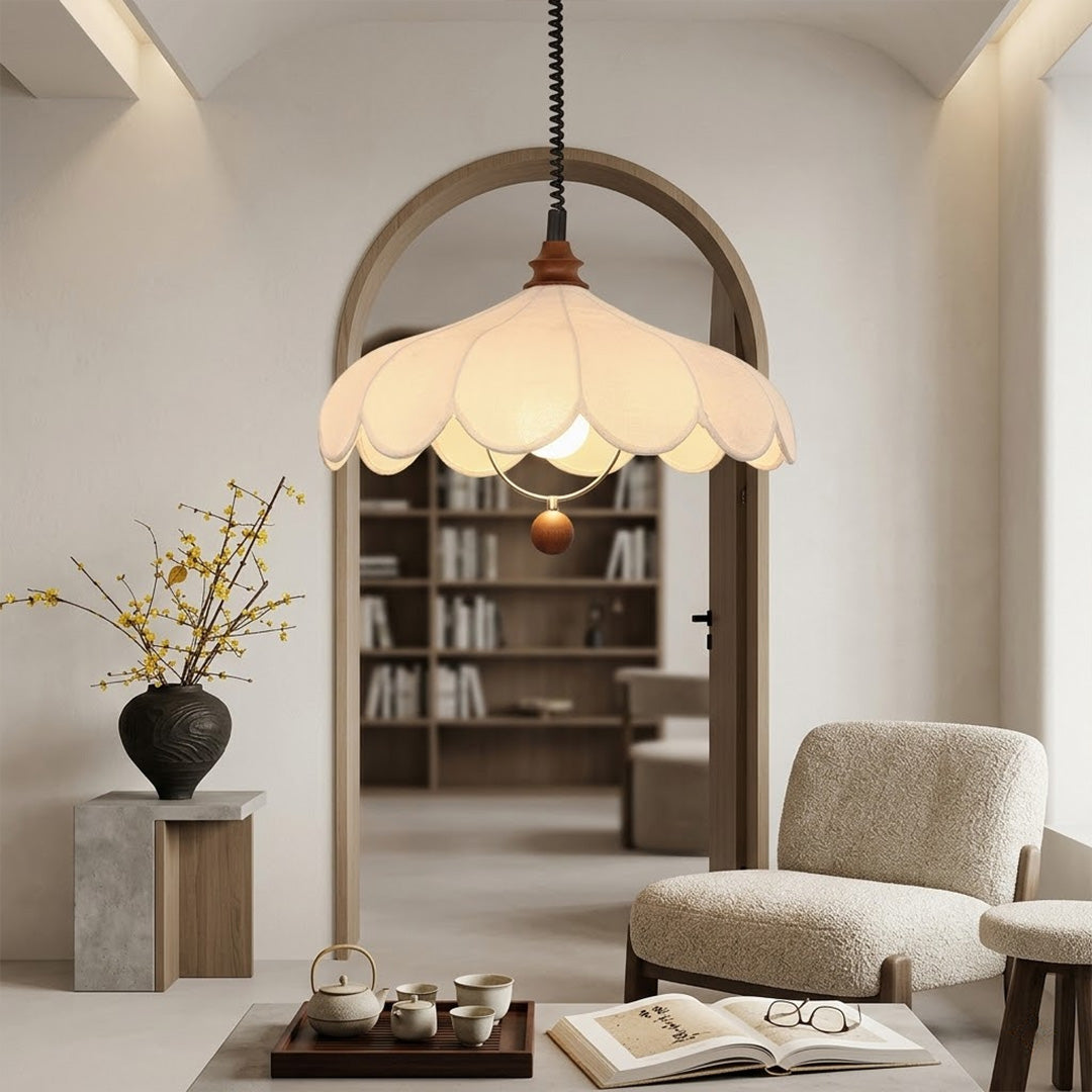 Linen drum pendant light above dining table warm soft glow modern farmhouse interior