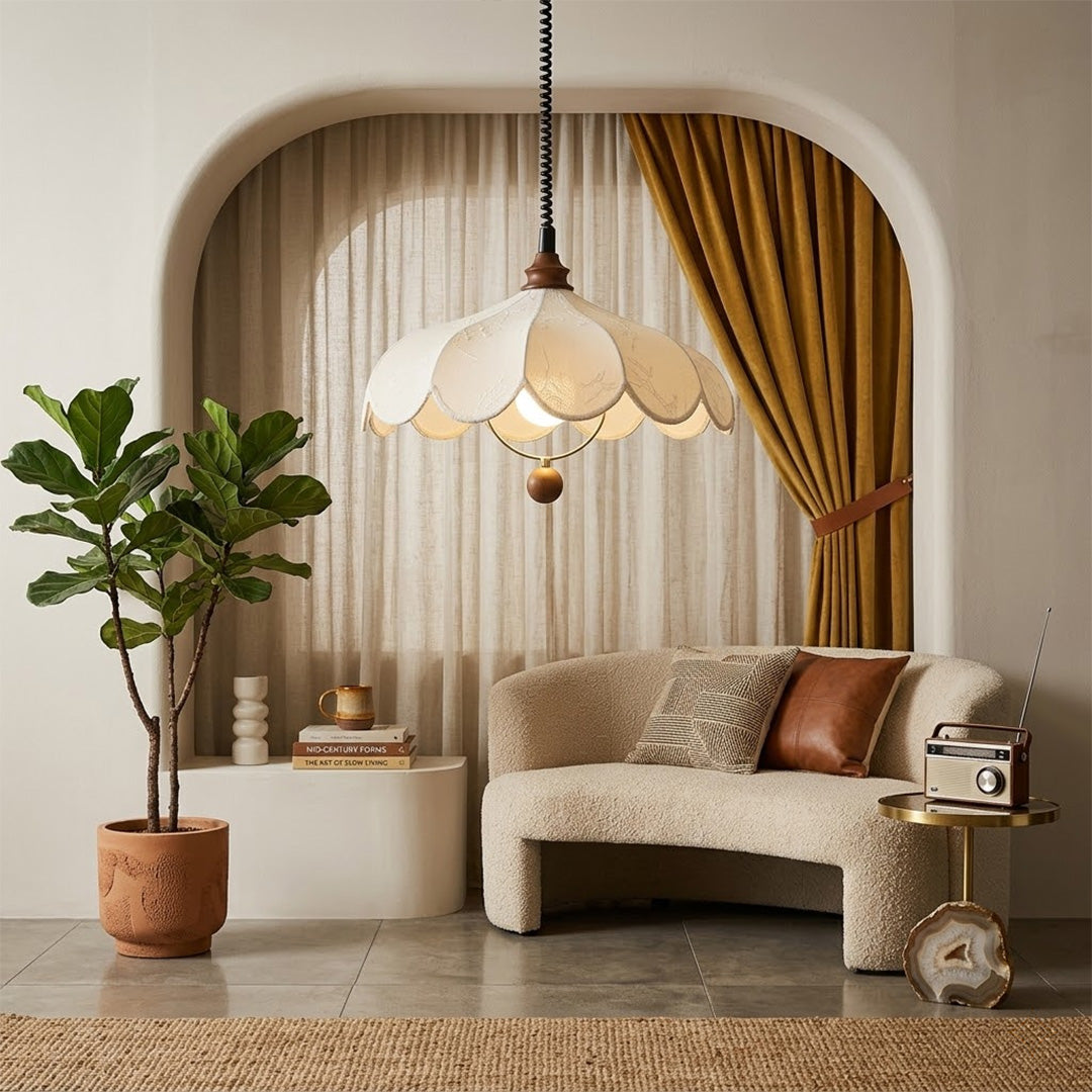 Linen drum pendant light above bedroom or living room warm ambient glow
