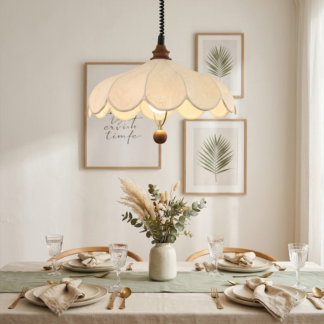 Linen drum pendant light above dining table warm soft glow modern farmhouse interior