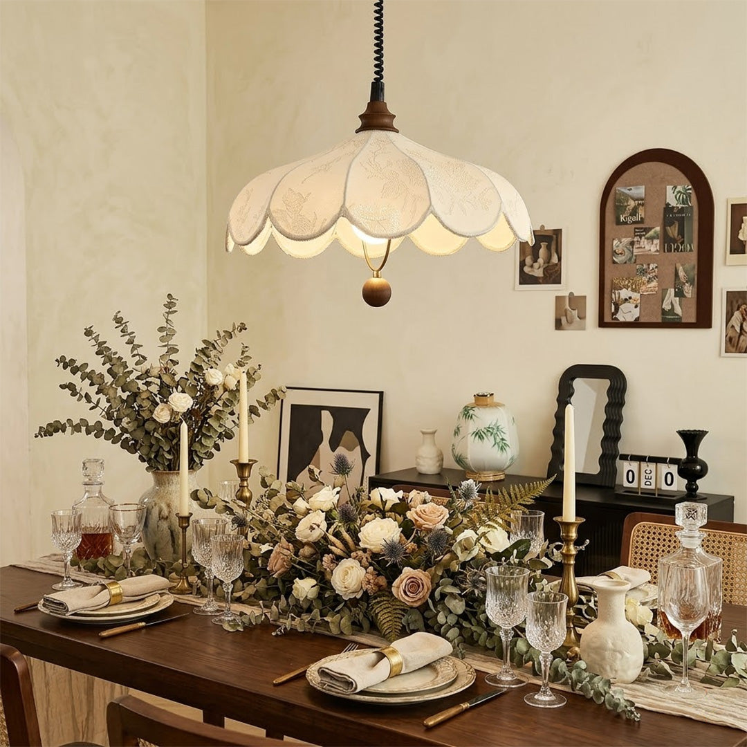 Linen drum pendant light above bedroom or living room warm ambient glow