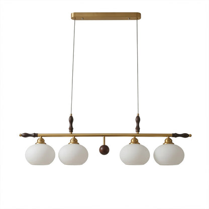 Linora gold linear pendant light above kitchen island warm ribbed glass globe glow organic modern interior