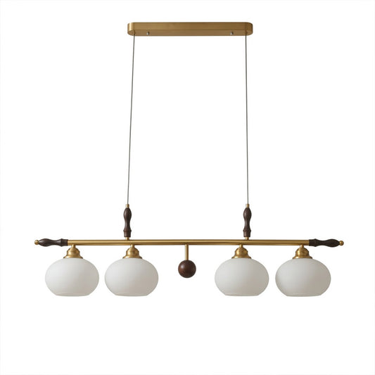Linora gold linear pendant light above kitchen island warm ribbed glass globe glow organic modern interior