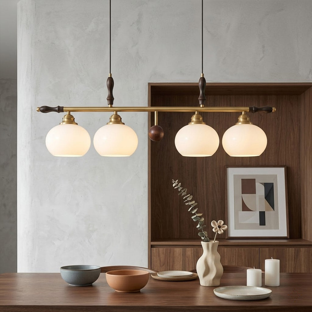 Linora gold linear pendant light above kitchen island warm ribbed glass globe glow organic modern interior