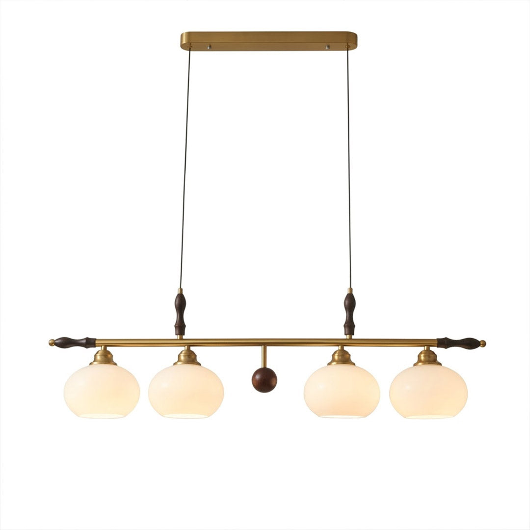Linora gold linear pendant light above kitchen island warm ribbed glass globe glow organic modern interior