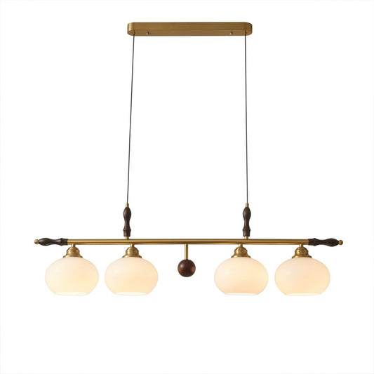 Linora gold linear pendant light above kitchen island warm ribbed glass globe glow organic modern interior