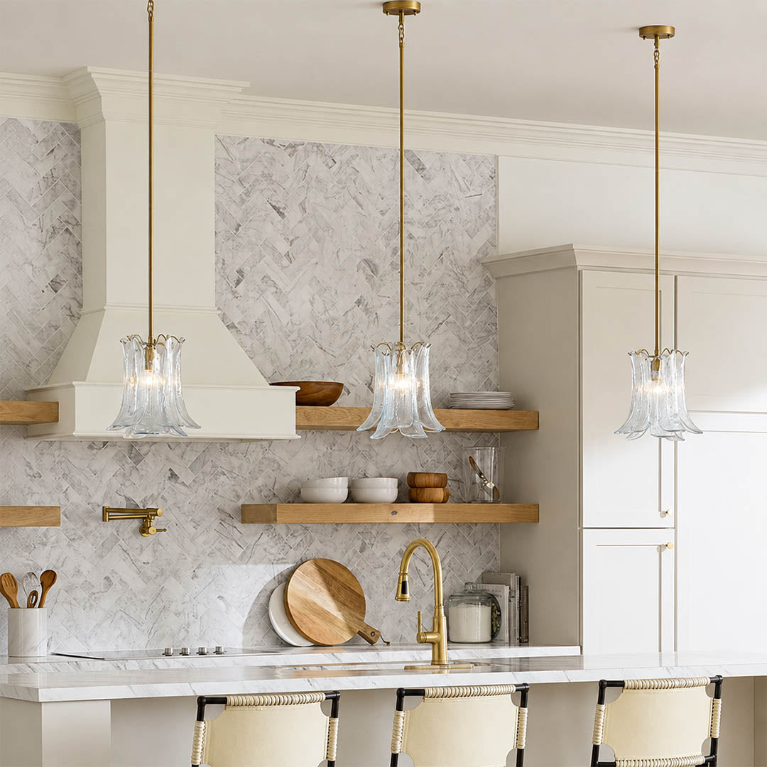 Livia clear crystal petal glass pendant lights kitchen island 3 pendant cluster walnut wood countertop brass gold rod modern vintage warm glow lifestyle interior