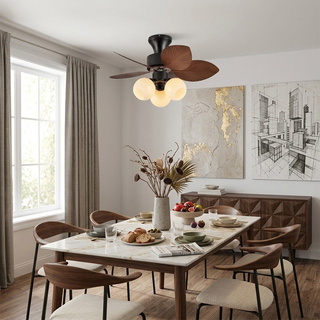 Lotus vintage ceiling fan-A with light above bed warm glass shade glow bedroom interior