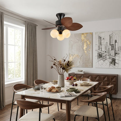 Lotus vintage ceiling fan-A with light above bed warm glass shade glow bedroom interior