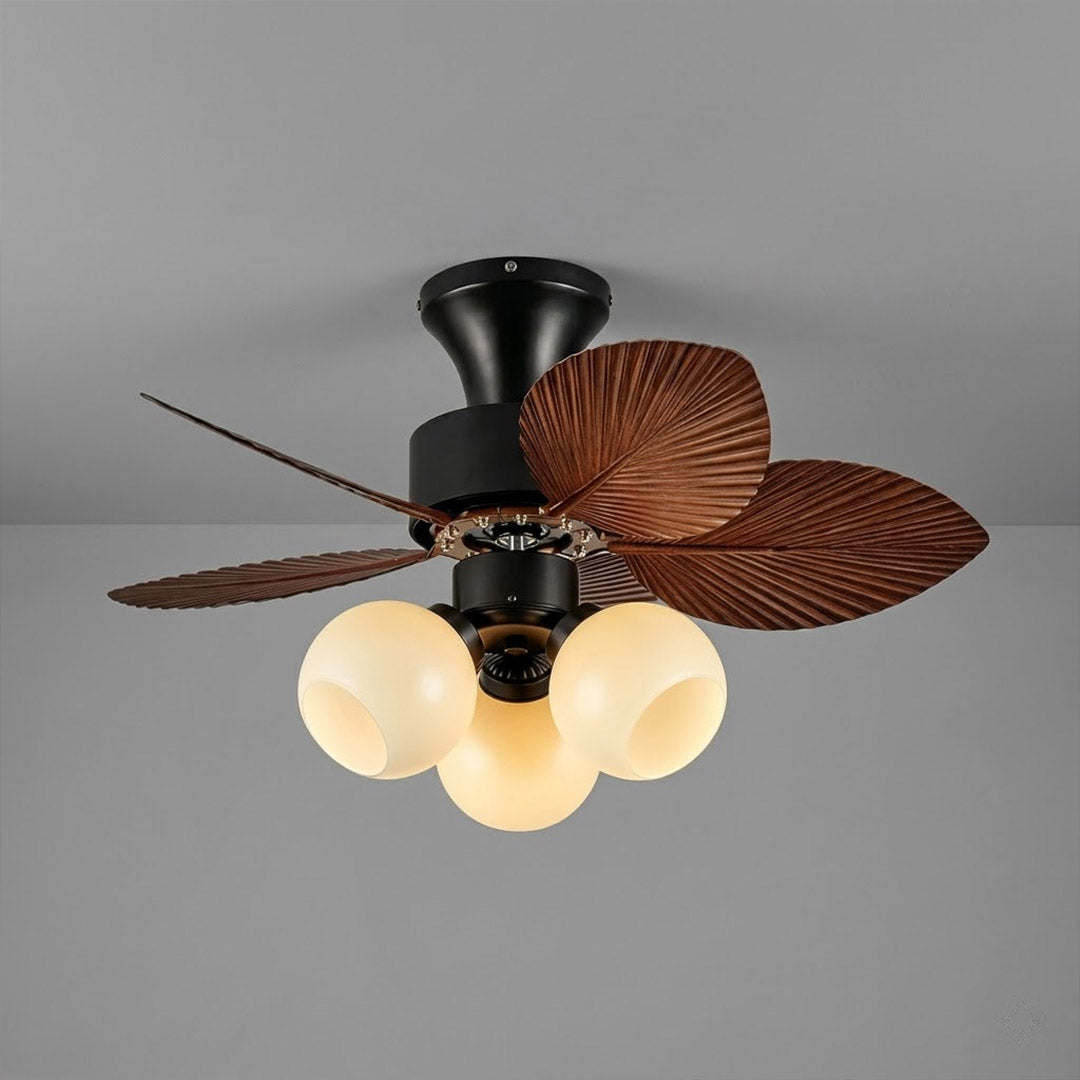 Lotus vintage ceiling fan-A with light above bed warm glass shade glow bedroom interior