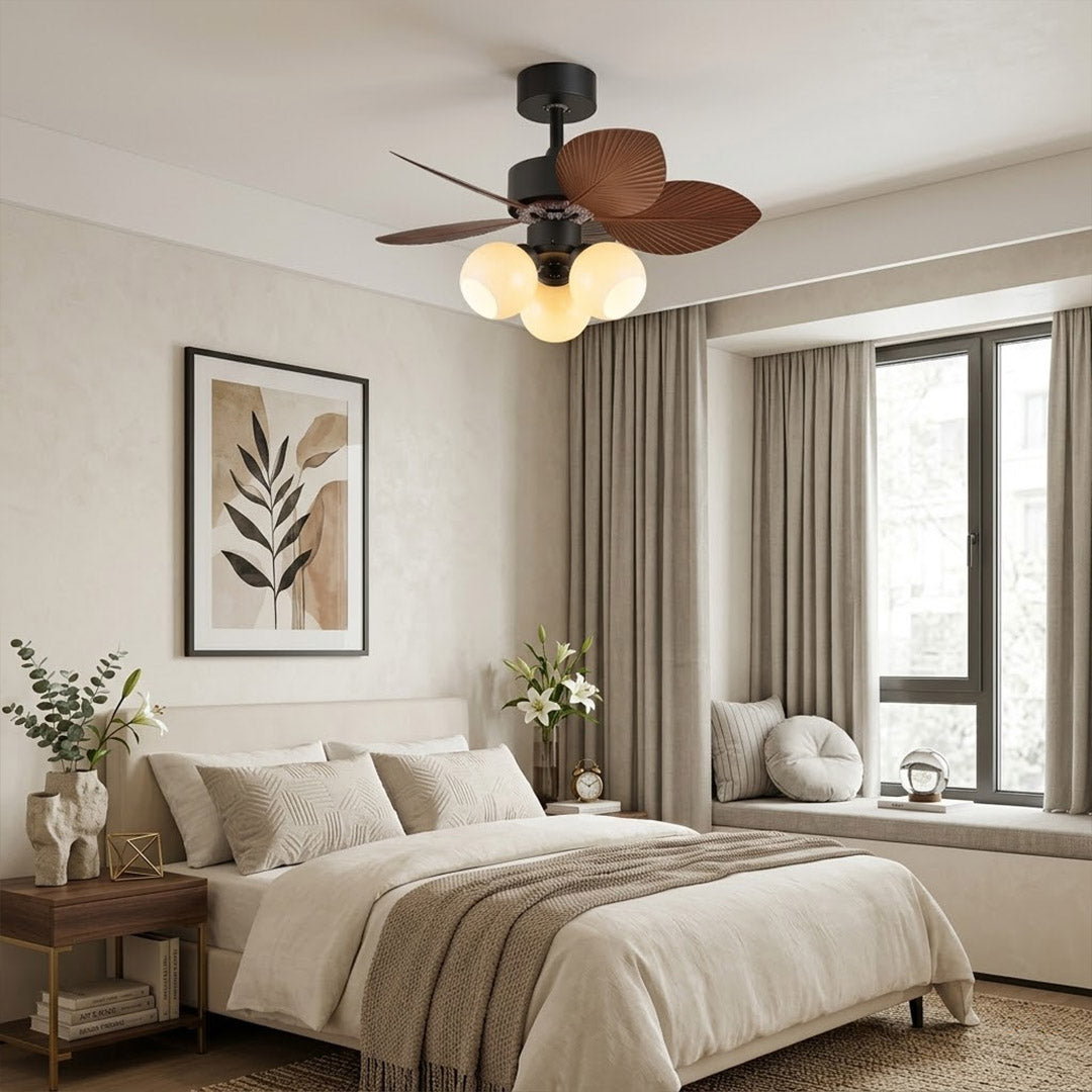 Lotus vintage ceiling fan with light above bed warm glass shade glow bedroom interior