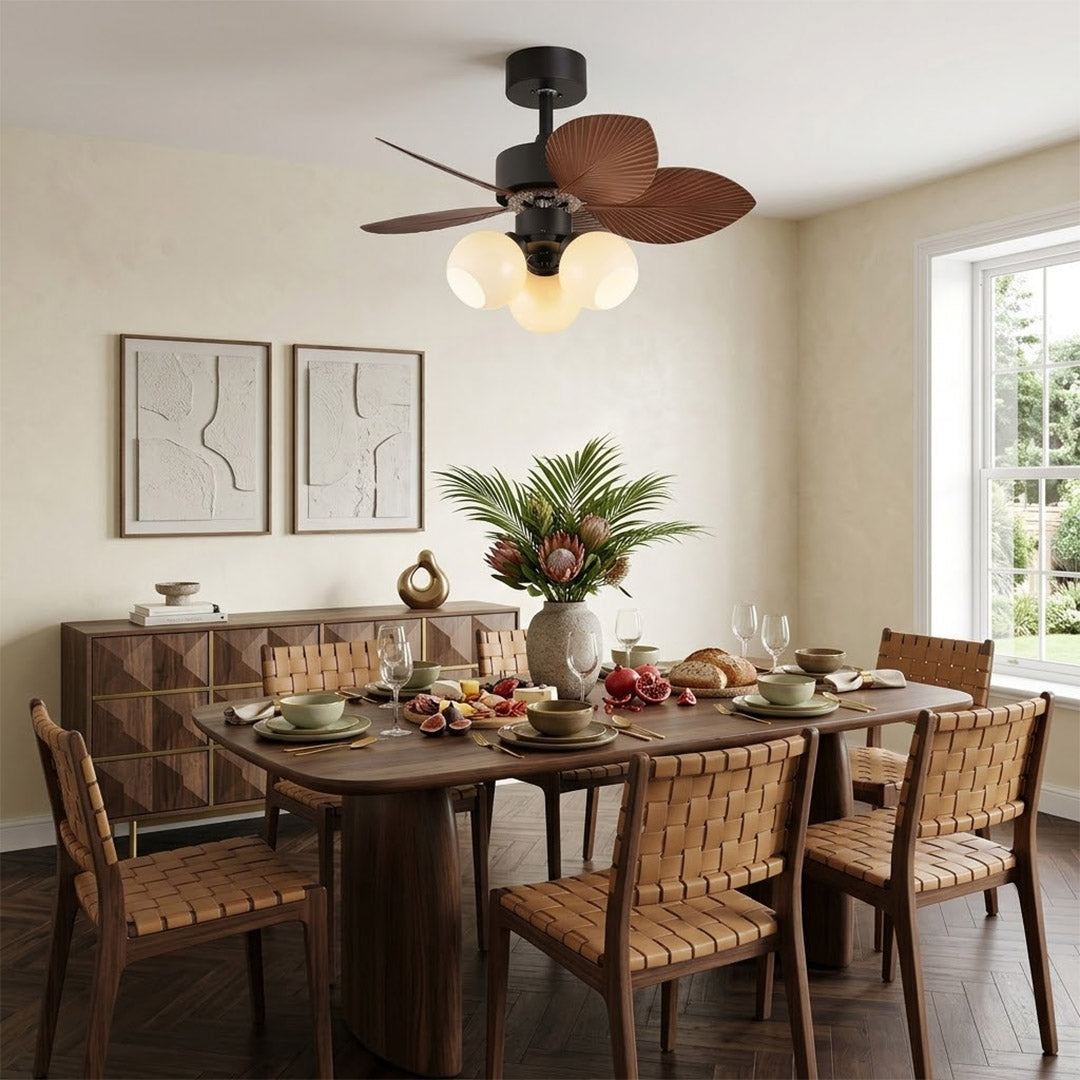Lotus vintage ceiling fan with light above bed warm glass shade glow bedroom interior