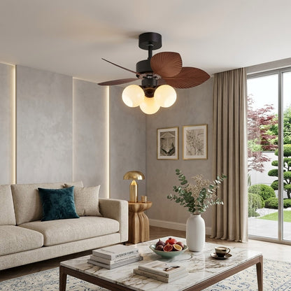 Lotus vintage ceiling fan with light above bed warm glass shade glow bedroom interior