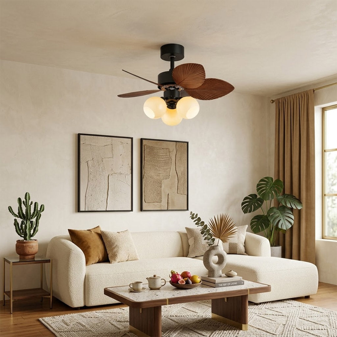 Lotus vintage ceiling fan with light above bed warm glass shade glow bedroom interior
