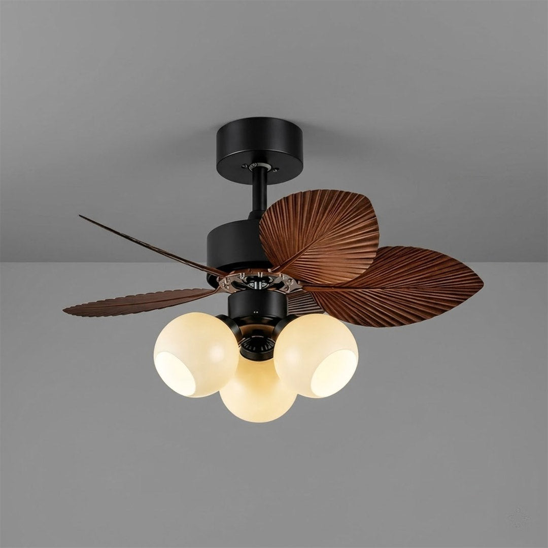 Lotus vintage ceiling fan with light above bed warm glass shade glow bedroom interior