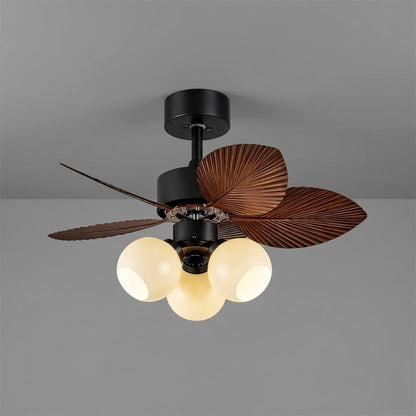 Lotus vintage ceiling fan with light above bed warm glass shade glow bedroom interior