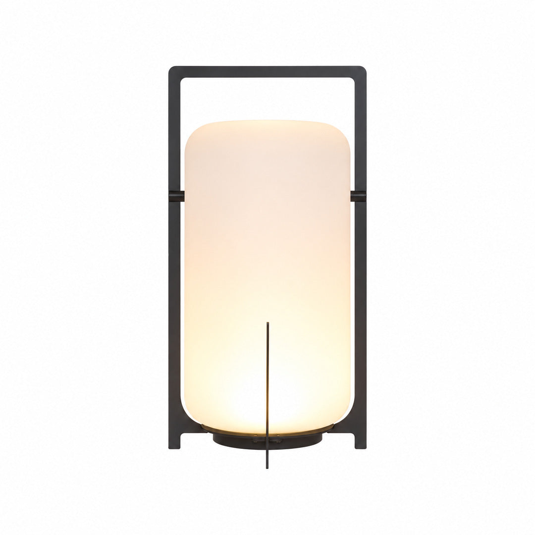 Large 21.3-inch black Lucciola rechargeable floor lantern with a glass shade beside a lounge chair