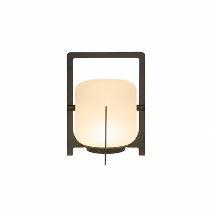 Small 11-inch black Lucciola rechargeable lantern with a glass shade on a bistro table
