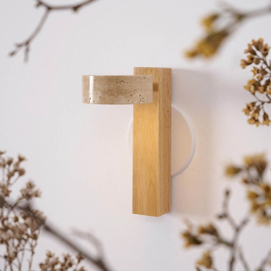 Lumen wall lamp yellow travertine stone lit natural veining detail close up